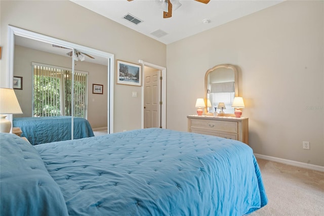 bedroom with light carpet and ceiling fan