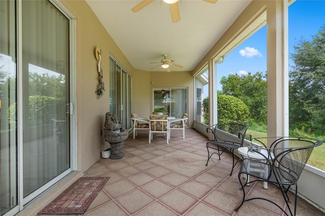 sunroom / solarium with ceiling fan