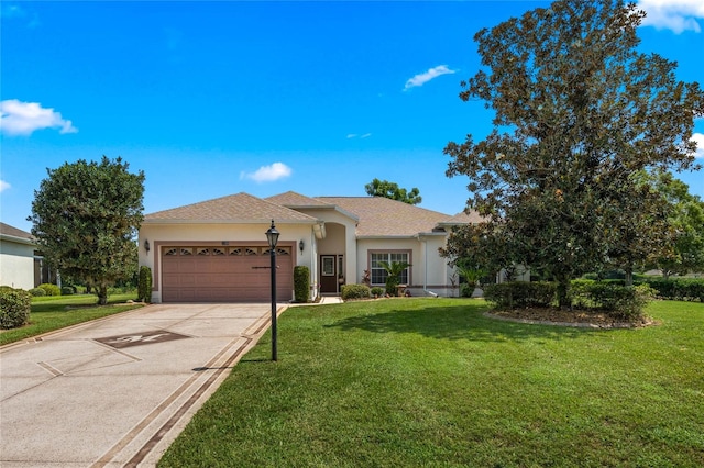 ranch-style house featuring a garage and a front lawn