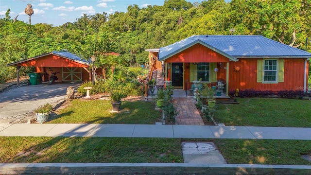 view of front of home with a carport, covered porch, and a front yard