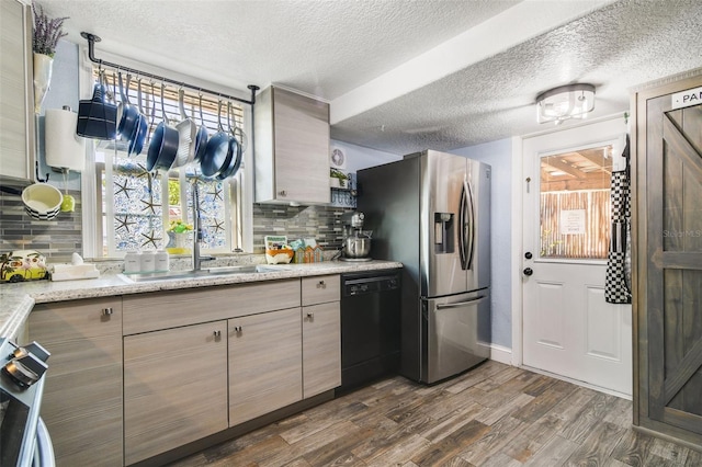 kitchen with decorative backsplash, stainless steel refrigerator with ice dispenser, black dishwasher, and dark hardwood / wood-style floors