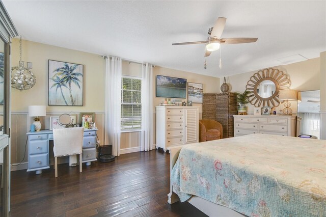 bedroom with ceiling fan and dark wood-type flooring