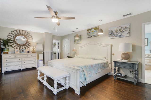 bedroom with ceiling fan, dark hardwood / wood-style flooring, and ensuite bathroom