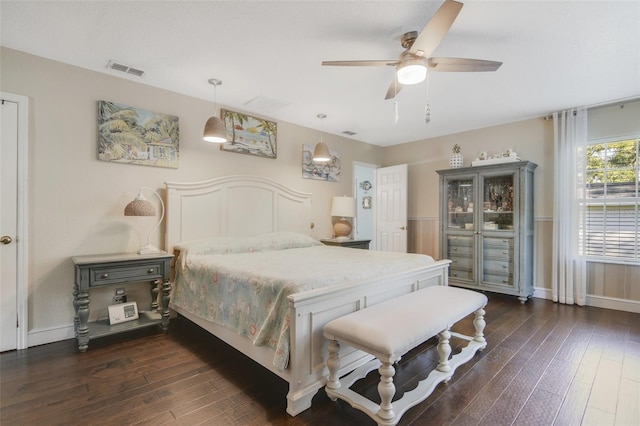 bedroom with ceiling fan and dark hardwood / wood-style floors