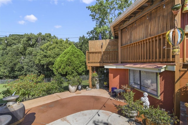 view of patio featuring a balcony