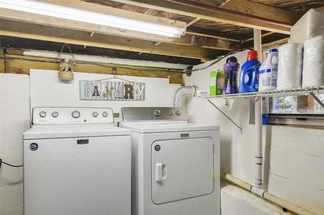 washroom featuring washer and clothes dryer