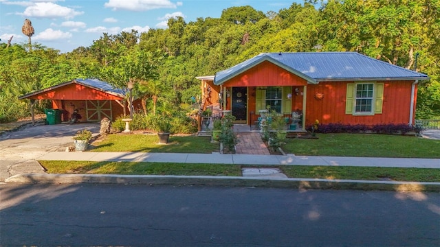 view of front of home with a porch, a carport, and a front lawn