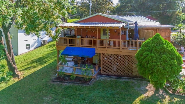 view of playground featuring a lawn and a deck