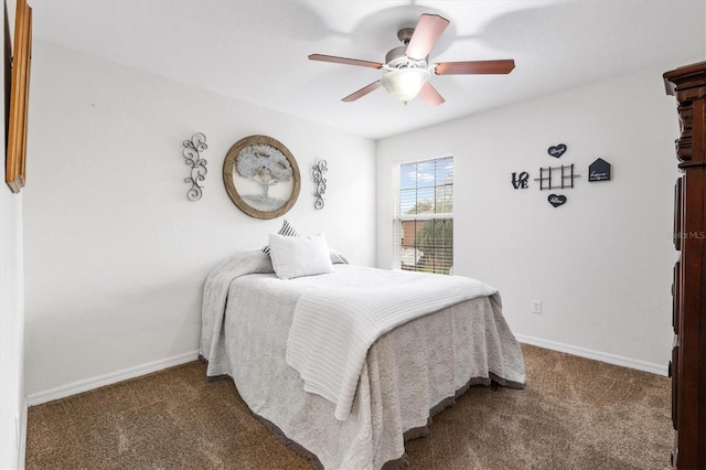 bedroom with ceiling fan and dark carpet