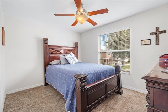 bedroom featuring light colored carpet and ceiling fan