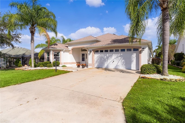 mediterranean / spanish-style home featuring a front yard and a garage