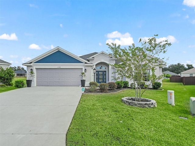 single story home with a front yard and a garage