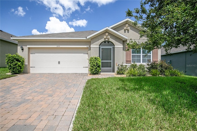 ranch-style house with a front yard and a garage