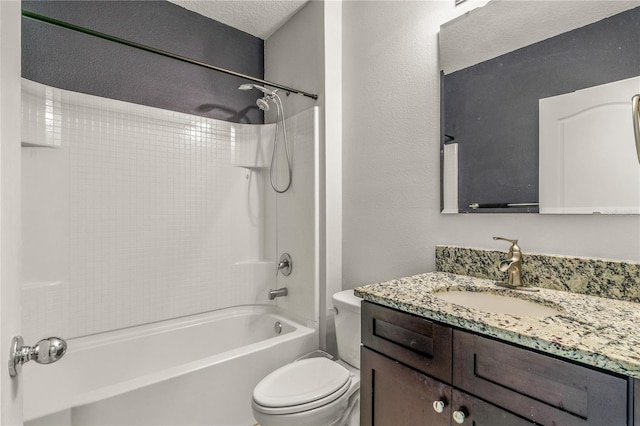 full bathroom featuring a textured ceiling, shower / bath combination, vanity, and toilet