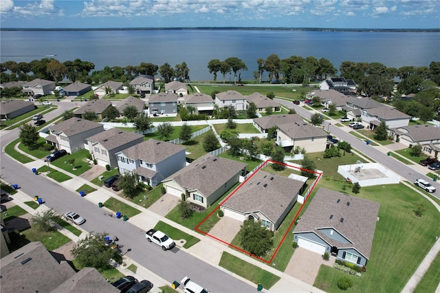 birds eye view of property with a water view