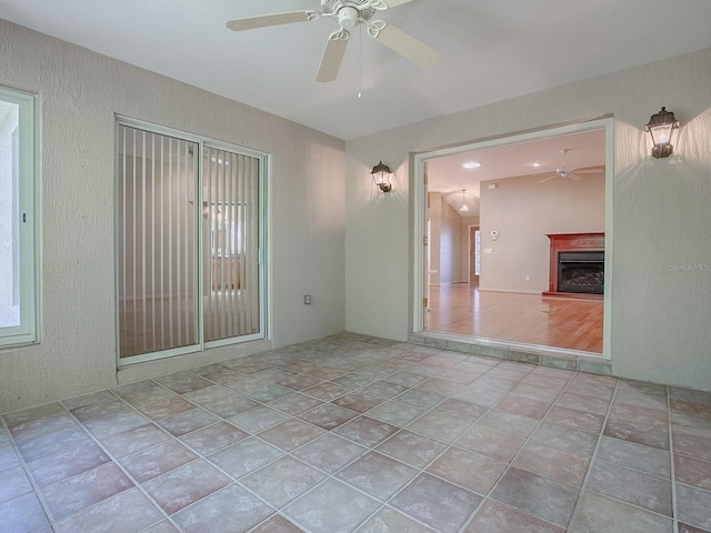 unfurnished room featuring light hardwood / wood-style flooring and ceiling fan