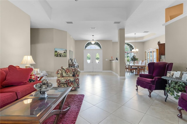 living room featuring an inviting chandelier and light tile patterned floors