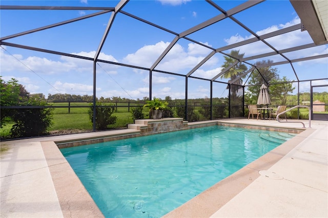 view of pool with a lanai and a patio