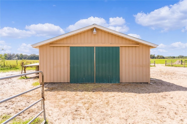 view of outbuilding with a rural view