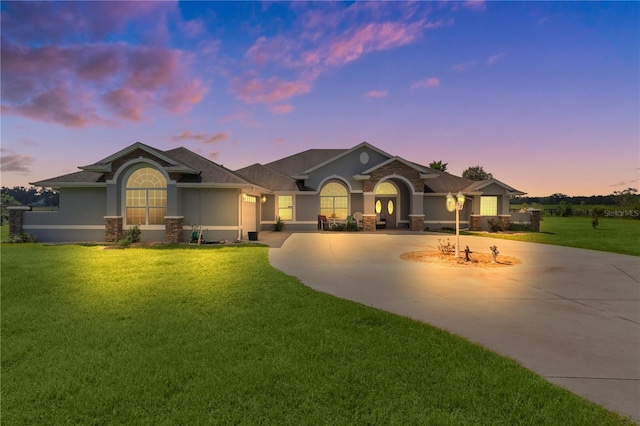 view of front of home with a yard