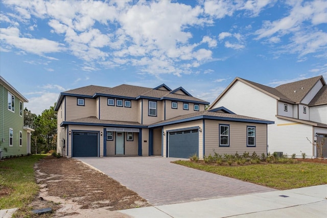 view of front of property with a front lawn and a garage