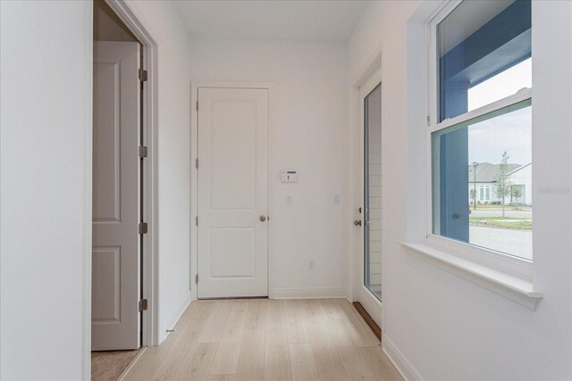 hall with light wood-type flooring