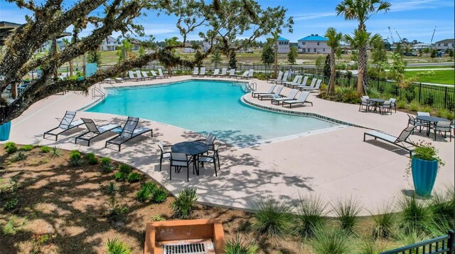 view of swimming pool with a patio