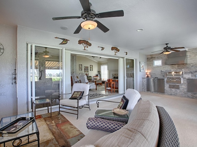 view of patio featuring area for grilling, ceiling fan, and an outdoor kitchen