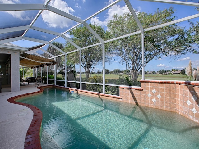 view of swimming pool with a patio and glass enclosure