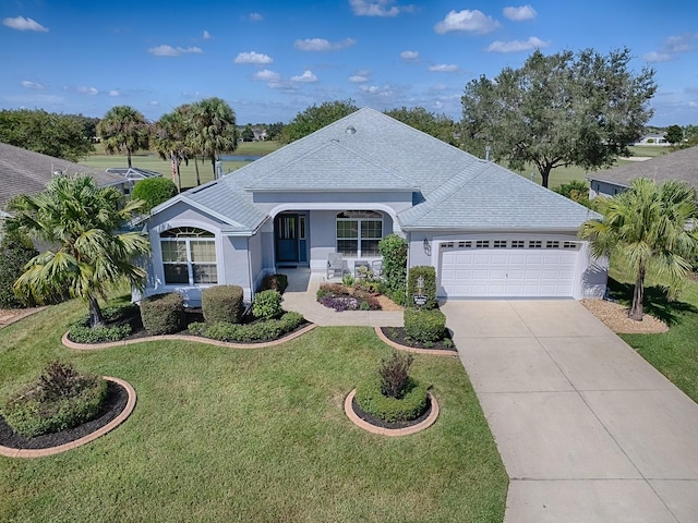 single story home with a front yard and a garage