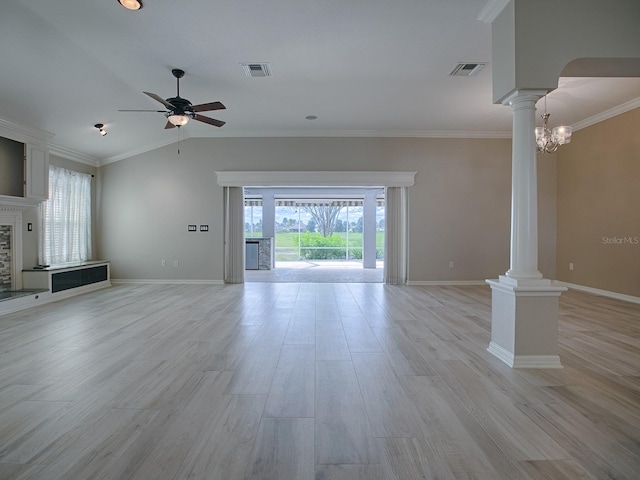 unfurnished living room featuring crown molding, light hardwood / wood-style flooring, ceiling fan with notable chandelier, and vaulted ceiling