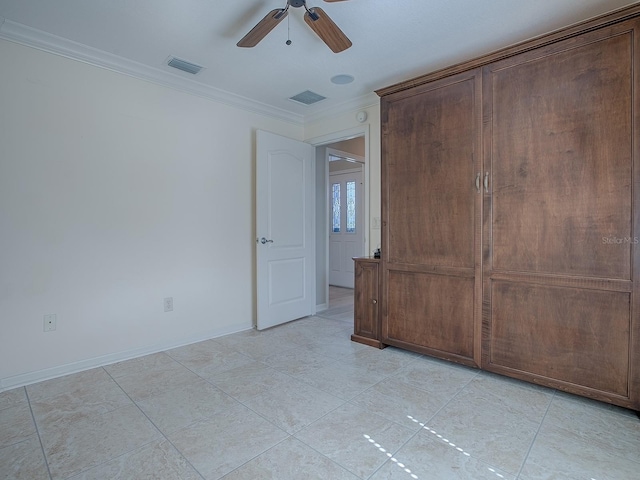 unfurnished room featuring ornamental molding and ceiling fan