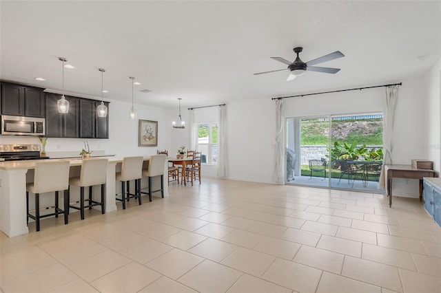 tiled living room with ceiling fan