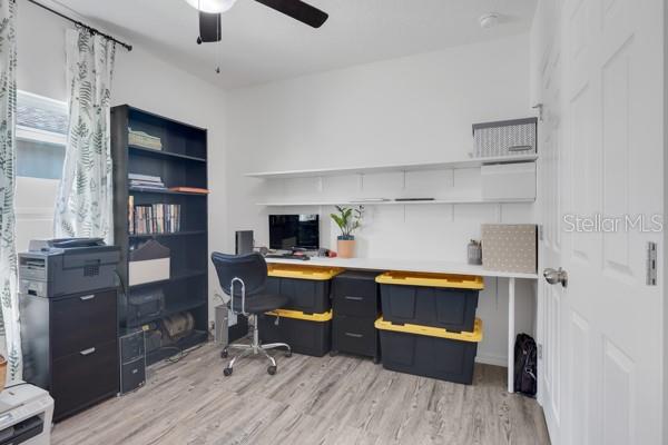 office featuring light wood-type flooring and ceiling fan