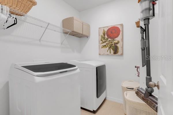 clothes washing area with independent washer and dryer