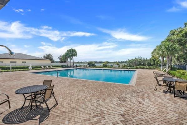 view of swimming pool featuring a patio area