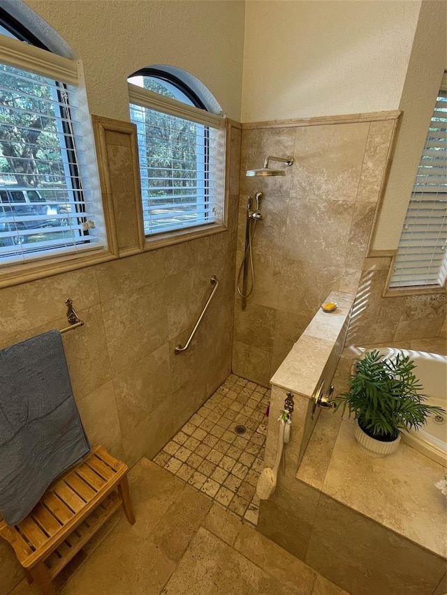 bathroom with a tile shower