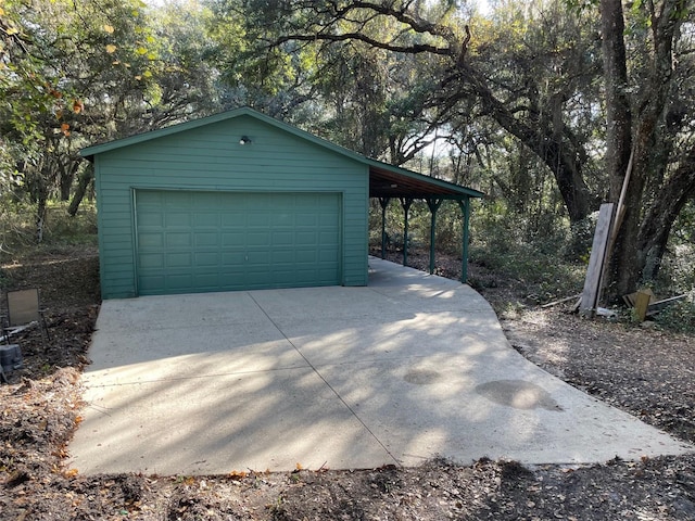 garage featuring a carport