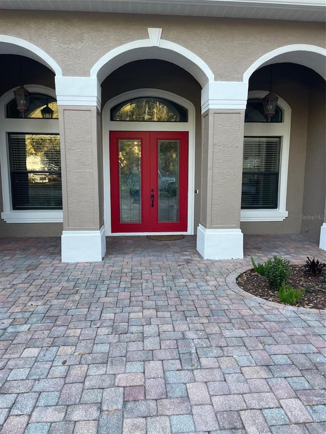 view of exterior entry featuring french doors