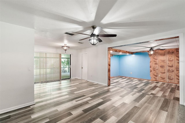 unfurnished room featuring wood-type flooring and ceiling fan