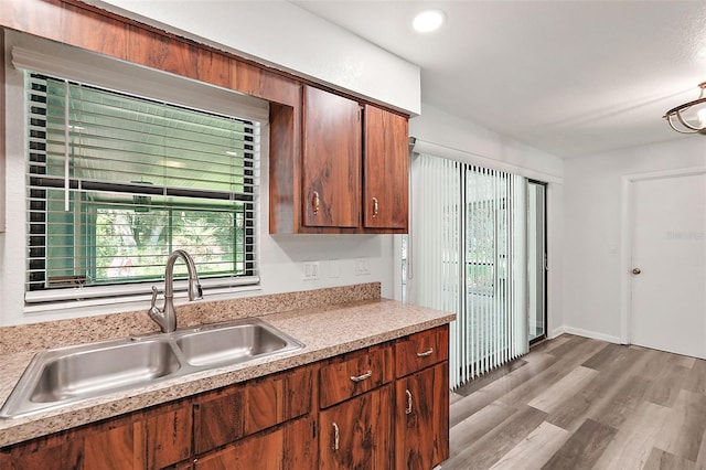 kitchen featuring sink and light hardwood / wood-style flooring