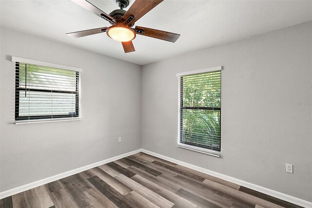 spare room with hardwood / wood-style flooring