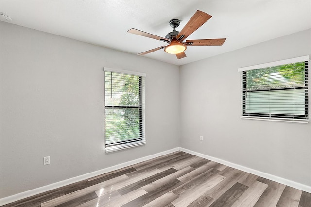 unfurnished room with ceiling fan and light hardwood / wood-style flooring