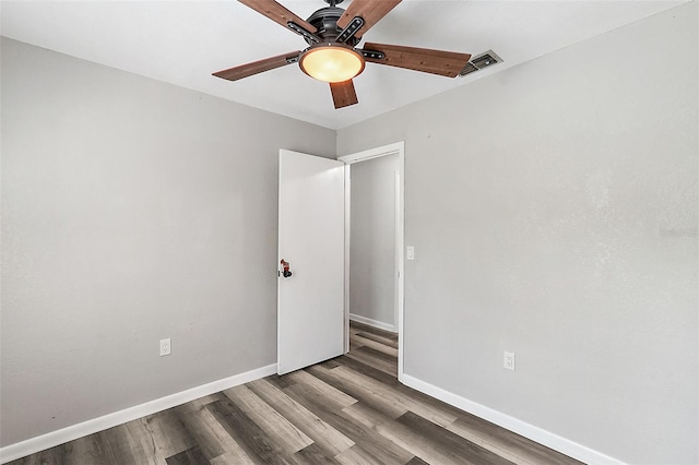 empty room featuring wood-type flooring