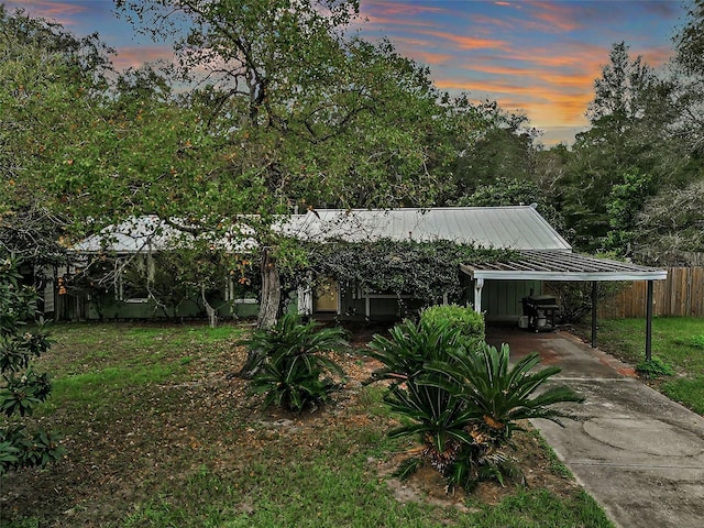 view of front facade with a carport