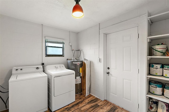 washroom featuring separate washer and dryer, a textured ceiling, electric water heater, and dark hardwood / wood-style floors