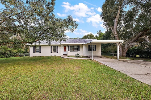 single story home featuring a front yard and a carport