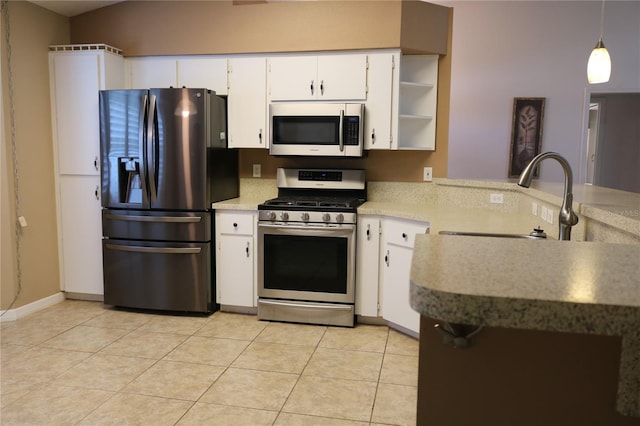 kitchen featuring light tile patterned flooring, a sink, white cabinetry, appliances with stainless steel finishes, and open shelves