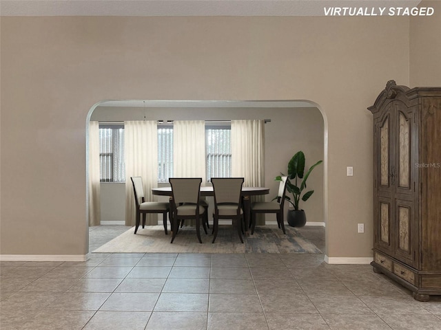 dining area with tile patterned floors