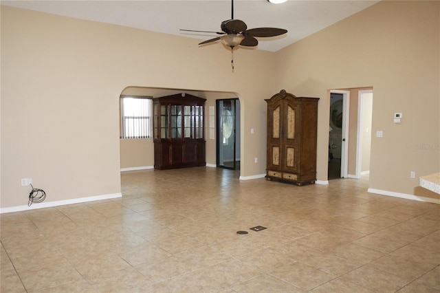 tiled spare room with ceiling fan